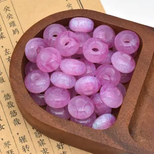 Close-up detail of starry glitter resin beads, large hole abacus wheel shape for DIY craft.