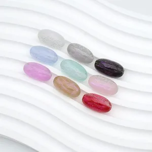 Detailed close-up of colorful 18mm mermaid glitter oval beads for DIY jewelry making accessories.