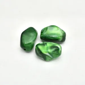 Green swirled acrylic irregular loose bead detail shot for DIY handmade crafting.