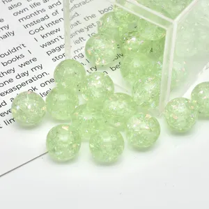 Transparent green opal resin round beads with glitter flakes for DIY jewelry making detail.