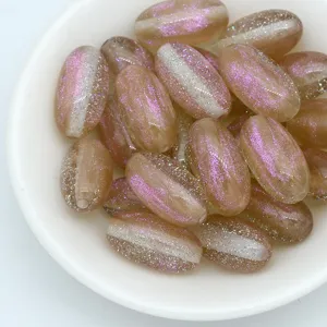 Detail shot of 18mm mermaid glitter oval beads, perfect for DIY jewelry making and crafting.