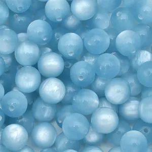 Close-up detail of light blue resin cat eye beads, perfect for DIY jewelry crafting projects.