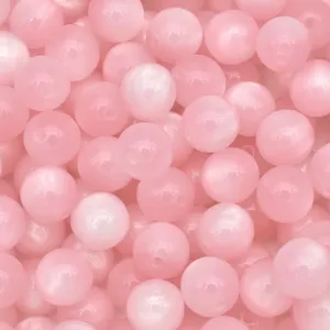 Pink resin cat eye beads detail, smooth round shape with hole for DIY jewelry making crafts.