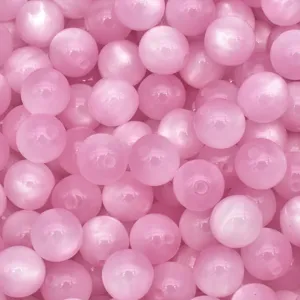Pink cat eye resin beads close-up detail, smooth surface texture for DIY jewelry making.