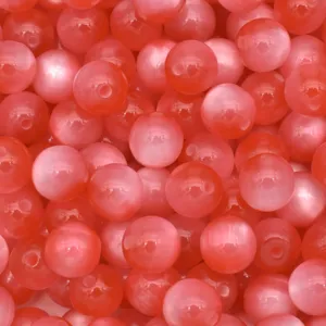Detailed shot of vibrant pink cat-eye resin beads, perfect for DIY jewelry crafting and beading projects.