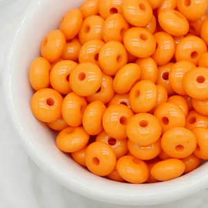 Glossy bright orange abacus rondelle spacer beads for DIY jewelry making and crafts.