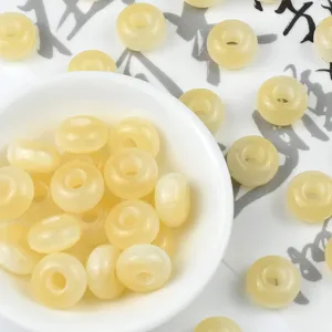 Detailed view of light yellow resin abacus beads, perfect for DIY jewelry and crafts.