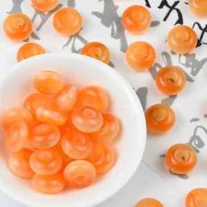 Details of orange resin cat's eye abacus beads for DIY bracelets and hair accessories.