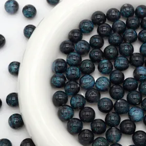 Resin starry beads close up detail view, sparkly round loose beads for DIY jewelry making.