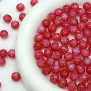 Red starry resin beads close-up detail shot, perfect for DIY jewelry making and bracelets.