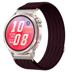 Close-up detail of sports smartwatch with breathable woven loop strap and metallic case.