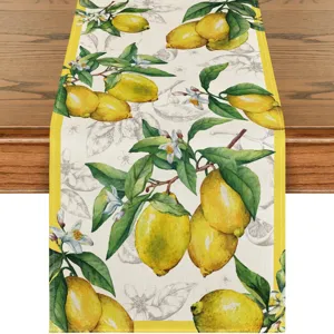 Detailed view of a watercolor lemon and floral pattern table runner, linen fabric home decor.