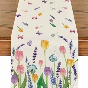Detail shot of watercolor floral linen table runner featuring tulip and butterfly prints.