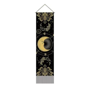 Detailed view of black and gold celestial moon and sun wall hanging tapestry with fringe.