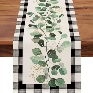 Linen table runner with eucalyptus leaf and buffalo plaid design for home dining party decor.