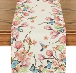 Linen table runner featuring a fresh spring floral butterfly and hummingbird detail design.