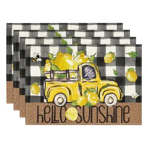 Linen placemat set detail featuring vintage truck lemon and black white plaid design.