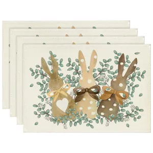 Linen placemats featuring cute watercolor cartoon rabbits and eucalyptus leaf patterns for table.
