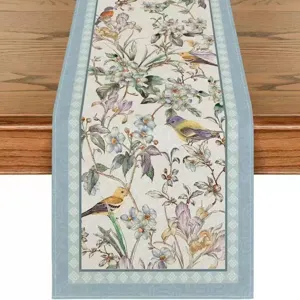 Elegant floral linen table runner for spring and summer dining table decoration.
