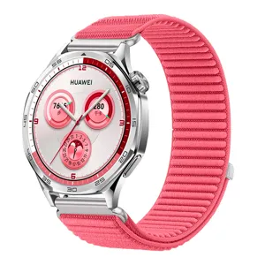 Detailed view of the pink woven smartwatch strap with metal connector and secure buckle design.