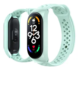 Mint green silicone strap detail, breathable perforated design for smart fitness tracker.