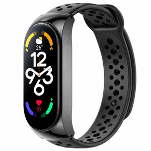 Black replacement strap and smart fitness tracker band with breathable perforated design.