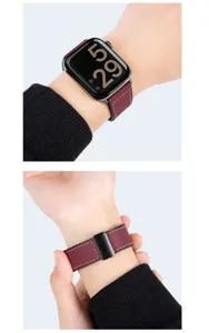 Detailed view of leather silicone watch strap worn on wrist, showing secure magnetic folding clasp.