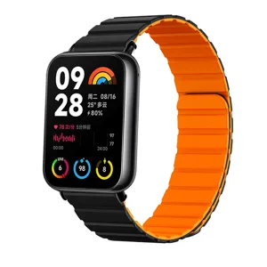 Detailansicht des zweifarbigen magnetischen Silikon-Uhrenarmbands in Schwarz und Orange.