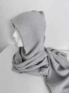 Detail shot of grey cotton linen hooded scarf shawl, showing soft texture and draped design.