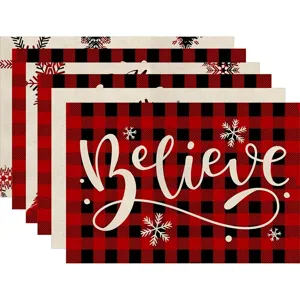 Christmas red and black buffalo plaid placemat set with snowflake and Believe text detail.