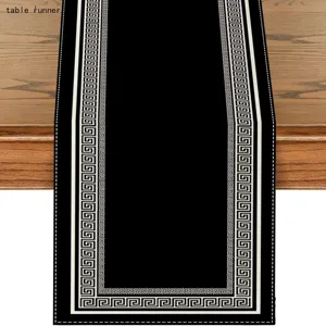 Black and white Greek key table runner for modern dining room and holiday home decor.