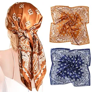 Detail view of a 90cm satin paisley square scarf showing vintage print and smooth texture.
