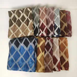 Close-up detail of women diamond geometric pattern printed scarf fabric texture showcase.