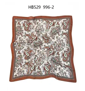 Detailed view of women silk square scarf featuring classic paisley floral pattern and border.