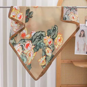 Detail shot of Chinese style lotus floral print silk square scarf, elegant beige scarf edge.