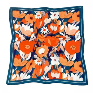 Women's satin square scarf with vibrant orange and white floral print on a dark blue background.