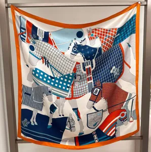 Detailed view of luxury equestrian silk twill square scarf featuring orange border design