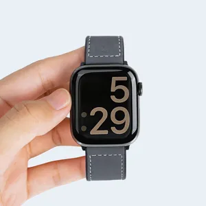 Grey leather strap compatible with smart watch, stylish replacement band for daily wear.