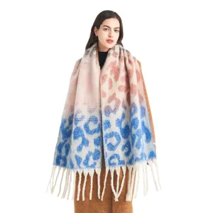 Detailed view of women gradient leopard print tassel scarf, elegant winter accessory style.