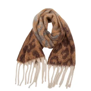 Detail view of retro leopard print winter tassel scarf closeup fabric texture accessory.