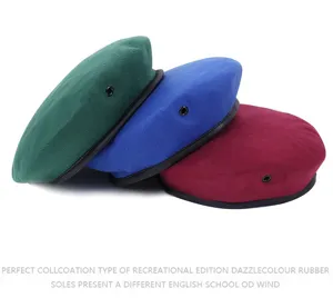 Detail shot of woolen beret set featuring green, blue and burgundy colors with leather trim.