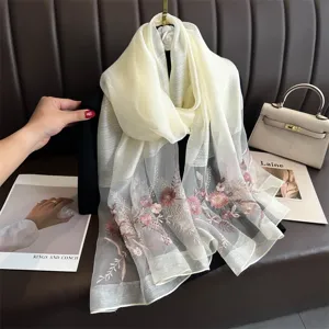 Elegant mulberry silk embroidered scarf with delicate floral design, lightweight and soft.