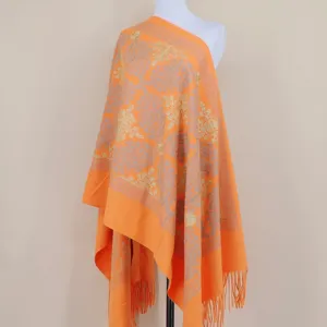 Orange cashmere shawl with gold embroidery, floral paisley pattern and fringe, elegant style.