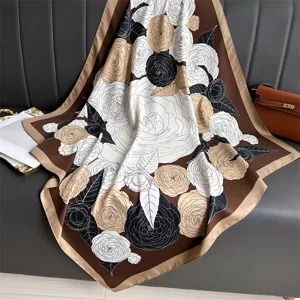 Camellia floral print silk square scarf detail, elegant brown accessory for women.