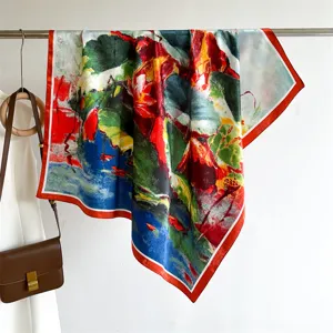 Detailed close-up view of the luxury silk square scarf with vibrant abstract floral art print.