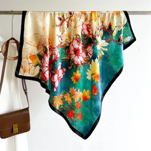 Elegant 90cm silk square scarf featuring vibrant floral, ginkgo and maple leaf prints.