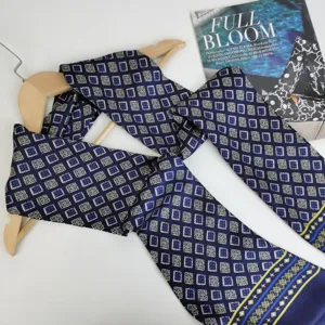 Detailed view of luxury vintage geometric patterned navy blue silk neck scarf for men.