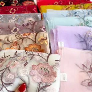 Exquisite silk embroidered scarves featuring floral designs and vibrant colors for autumn.