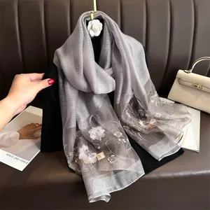 Exquisite silk embroidered scarf featuring delicate floral patterns for elegant daily style.