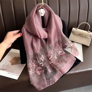 Elegant mulberry silk scarf with exquisite floral embroidery, perfect for autumn and winter.